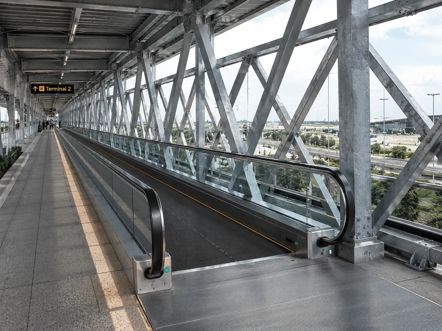 Heavy-duty travelator on a long outdoor transit link, hot-dip galvanised truss
